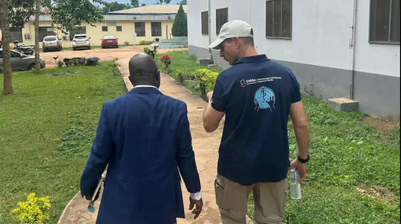 Sheba Medical Center team member with local official at Kpalimé hospital