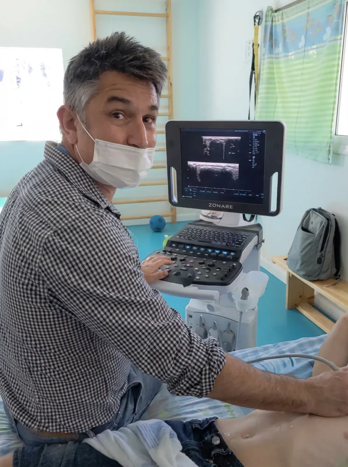 Doctor performing ultrasound with Zonare system